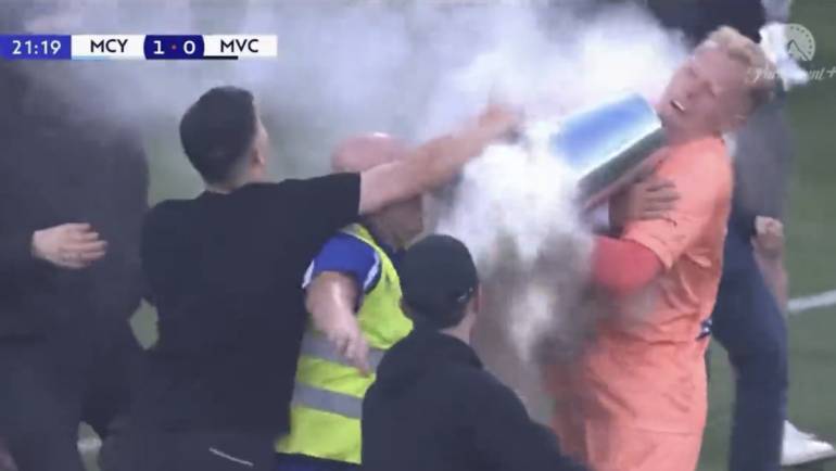 Soccer game in Australia breaks down in anarchy as fan attacks goalkeeper with metal bucket