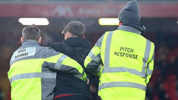 Liverpool: Pitch invader’s actions ‘unacceptable’ after collision with Andrew Robertson & Curtis Jones